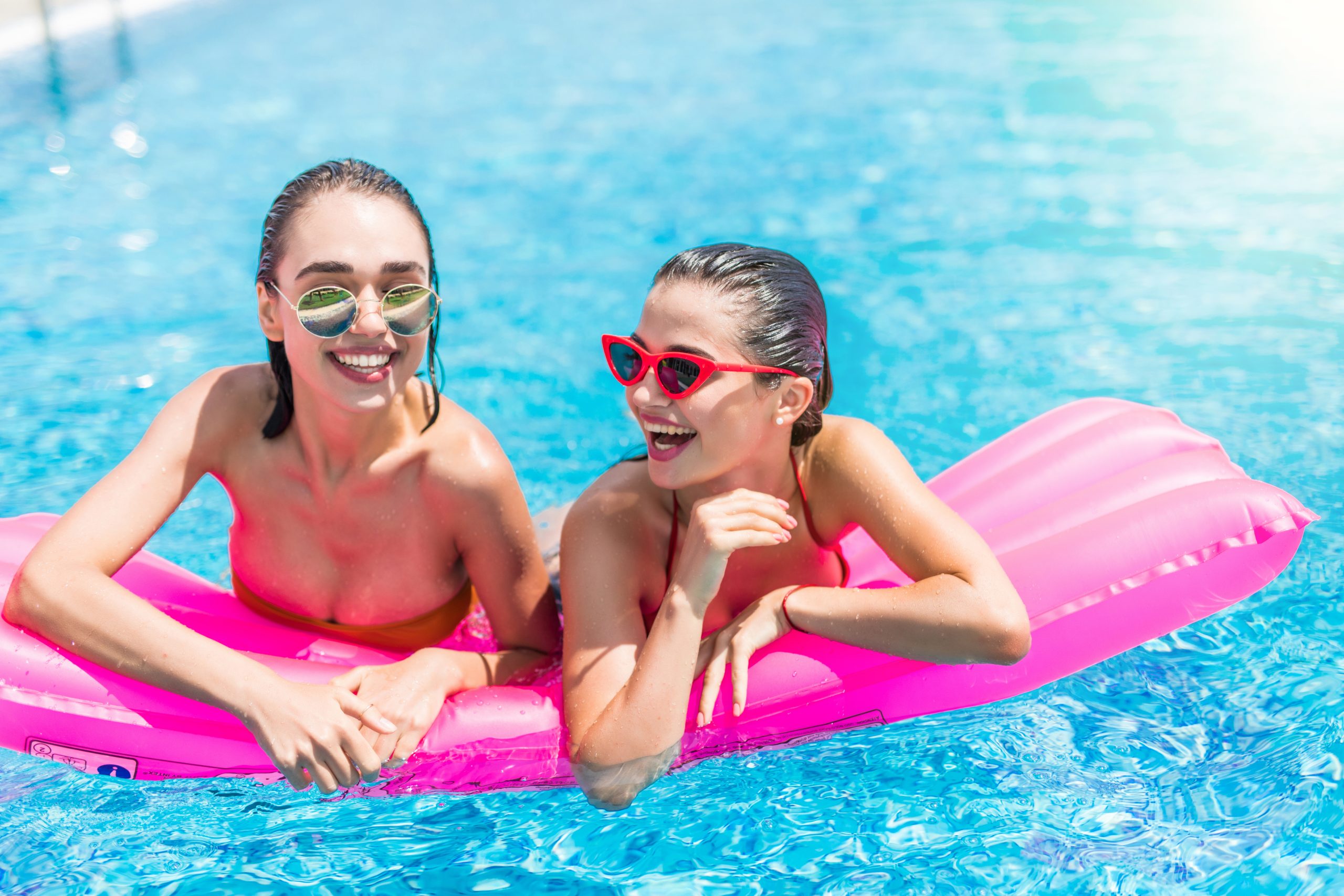 Melbourne teenagers swimming and relaxing by a backyard fibreglass pool, representing family connection and the teen trap concept for keeping kids at home.